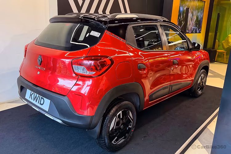 Renault Kwid Fiery Red With Mystery Black Roof Right Rear side showing taillights Renault Kwid Fiery Red With Mystery Black Roof Right Rear side showing taillights